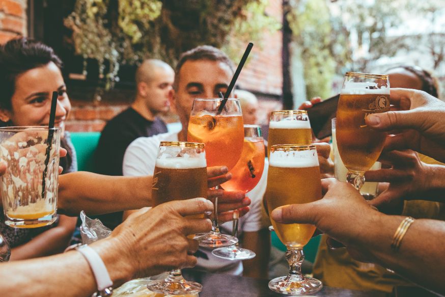 People talking and toasting in a pub